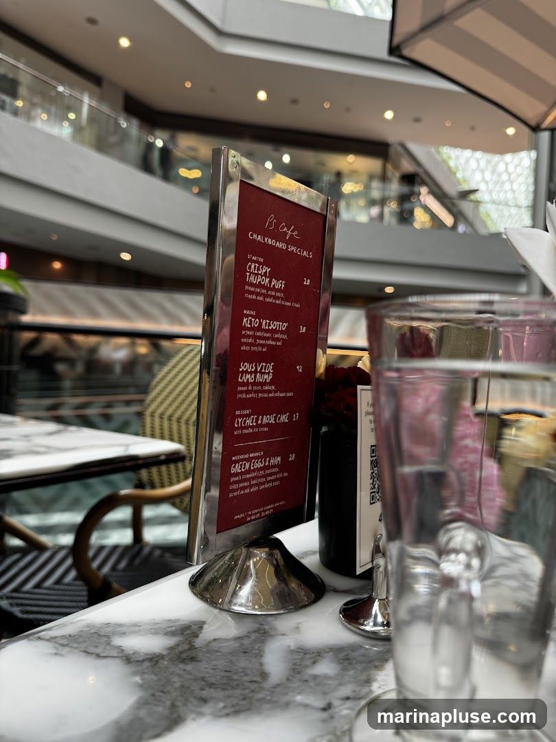 A menu board displaying specials at PS.Cafe.