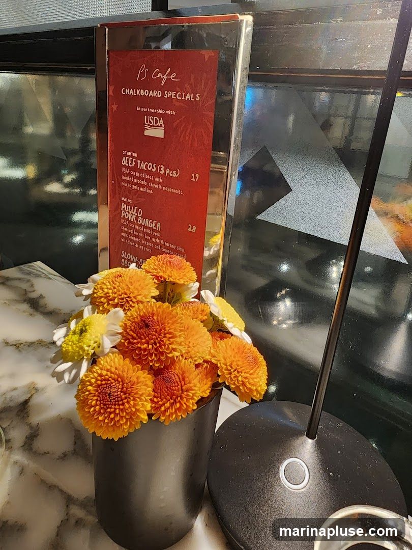 A menu board with specials from PS. Cafe, in partnership with USDA.