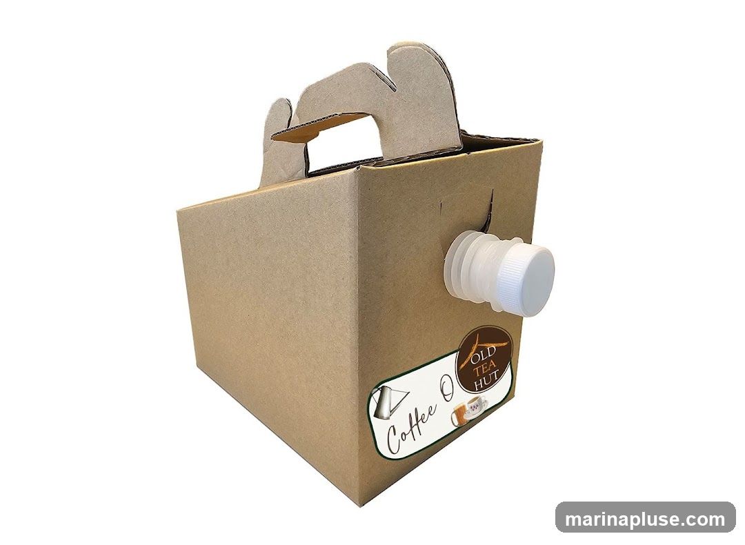 A cardboard box with a handle and a spigot, labeled "OLD TEA HUT" and "Coffee O".
