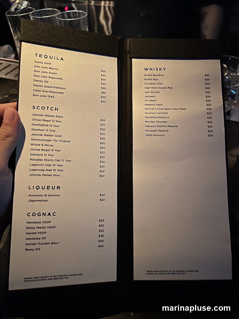 A menu featuring Tequila, Scotch, Liqueur, Cognac, and Whisky selections with prices.