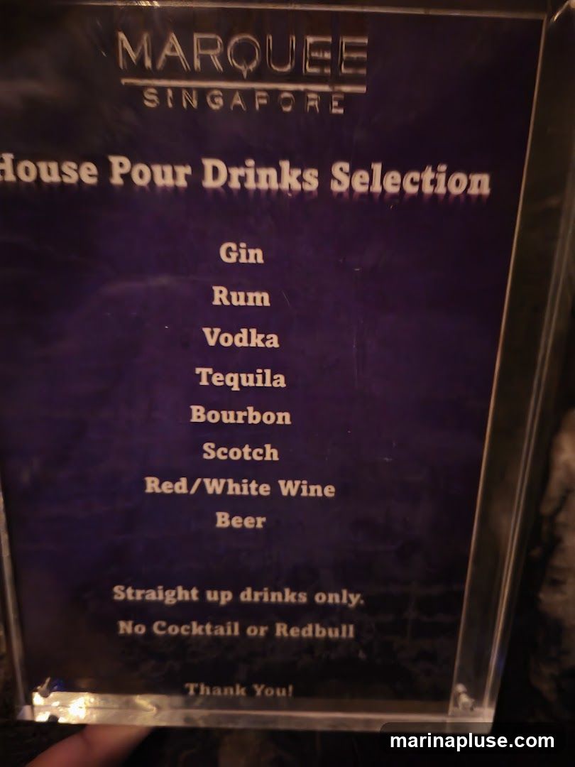 A menu board displaying a selection of house pour drinks.