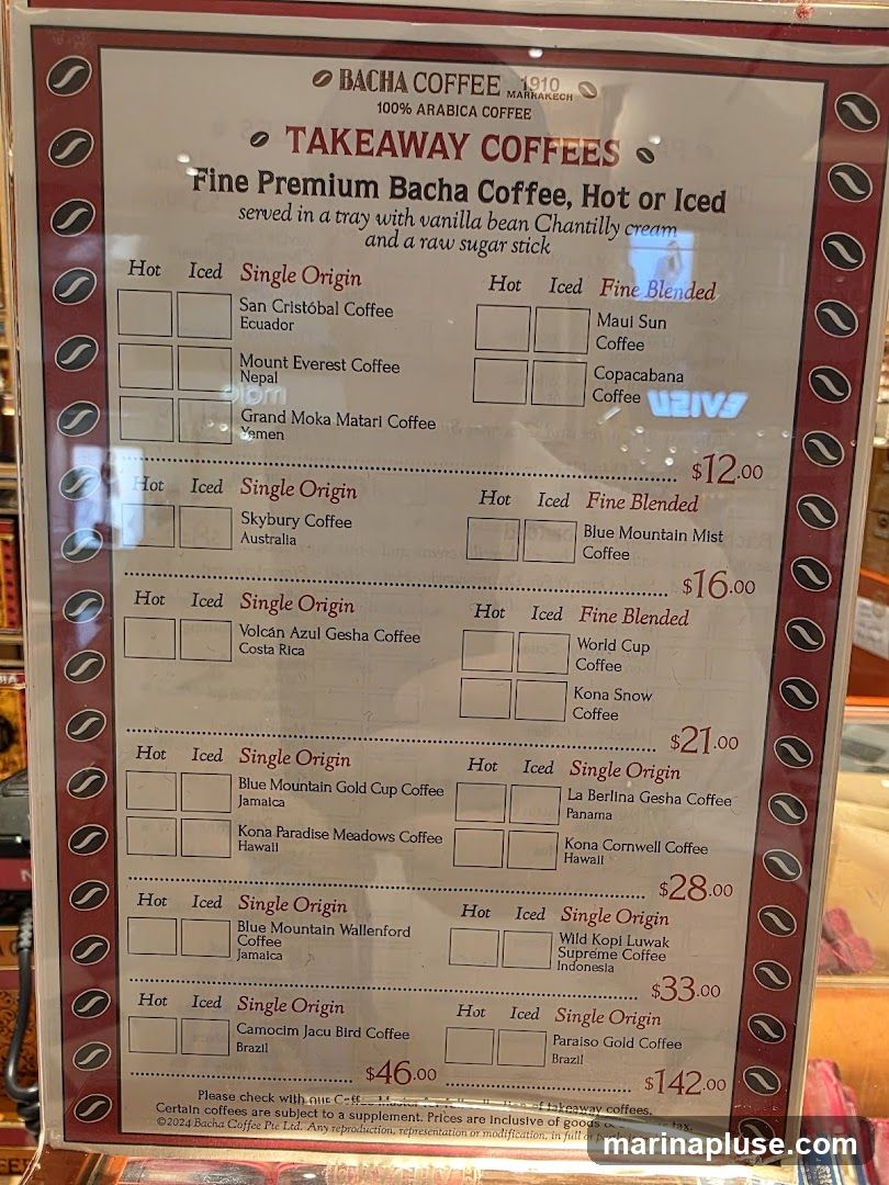 Fine Premium Bacha Coffee, Hot or Iced, served in a tray with vanilla bean Chantilly cream and a raw sugar stick.