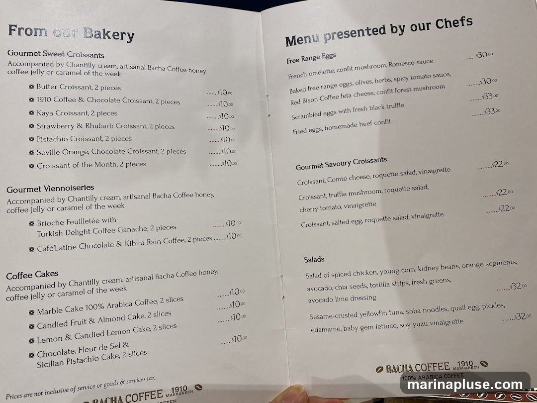 Menu from Bacha Coffee featuring bakery items, savory croissants, and salads.