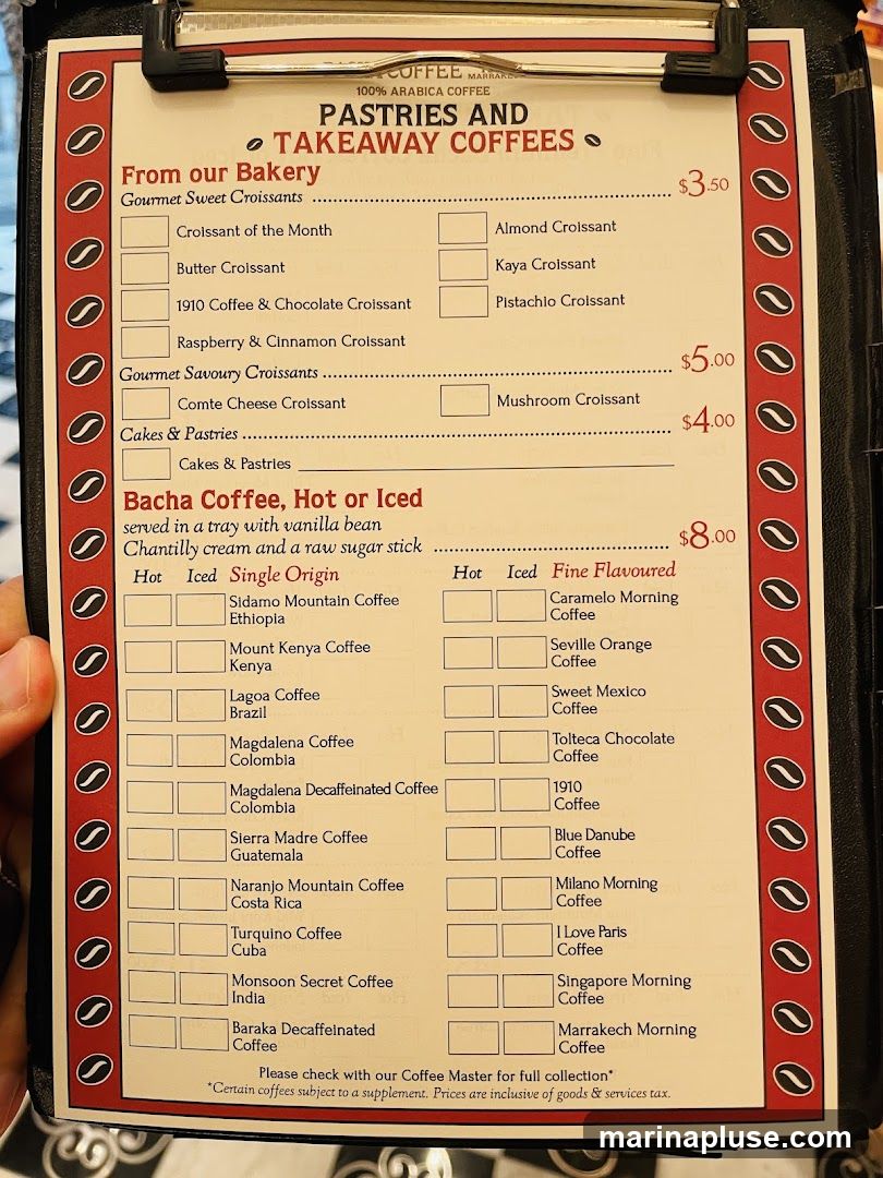 Menu featuring gourmet sweet and savory croissants, cakes, pastries, and a selection of hot or iced coffees.