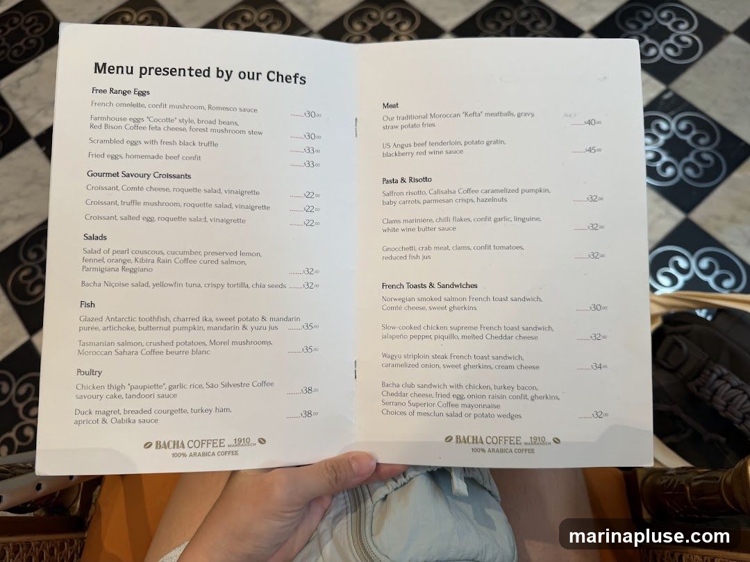 A menu with sections for Free Range Eggs, Gourmet Savoury Croissants, Salads, Fish, Poultry, Meat, Pasta & Risotto, and French Toasts & Sandwiches.