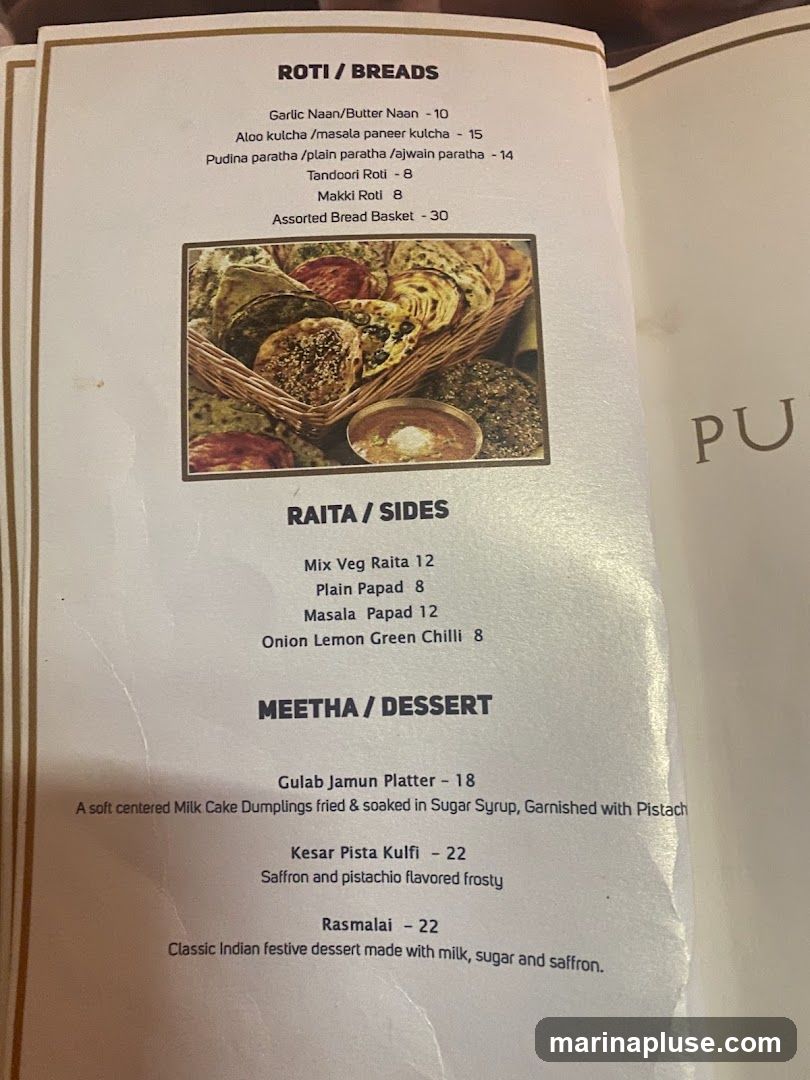 A menu featuring Roti/Breads, Raita/Sides, and Meetha/Dessert sections.