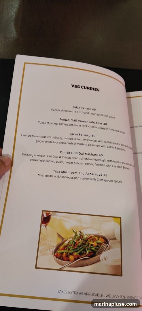 A menu page listing various vegetarian curry dishes.