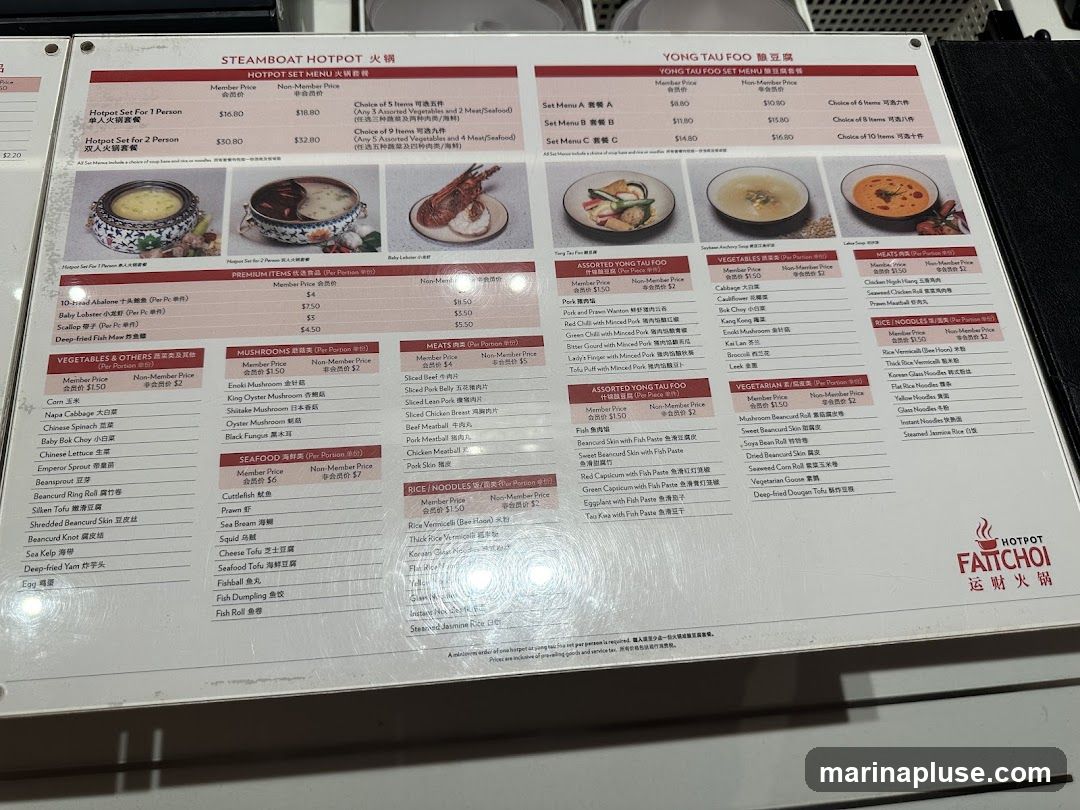 Menu for Steamboat Hotpot and Yong Tau Foo with various set menus and a la carte options for premium items, vegetables, mushrooms, seafood, meats, and noodles.