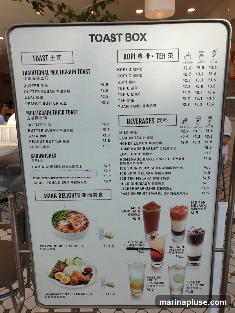 A menu board for Toast Box featuring traditional and multigrain toasts, sandwiches, Asian delights, Kopi, Teh, and other beverages.