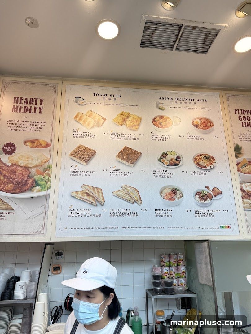 A menu board displaying various toast sets and Asian delight sets.