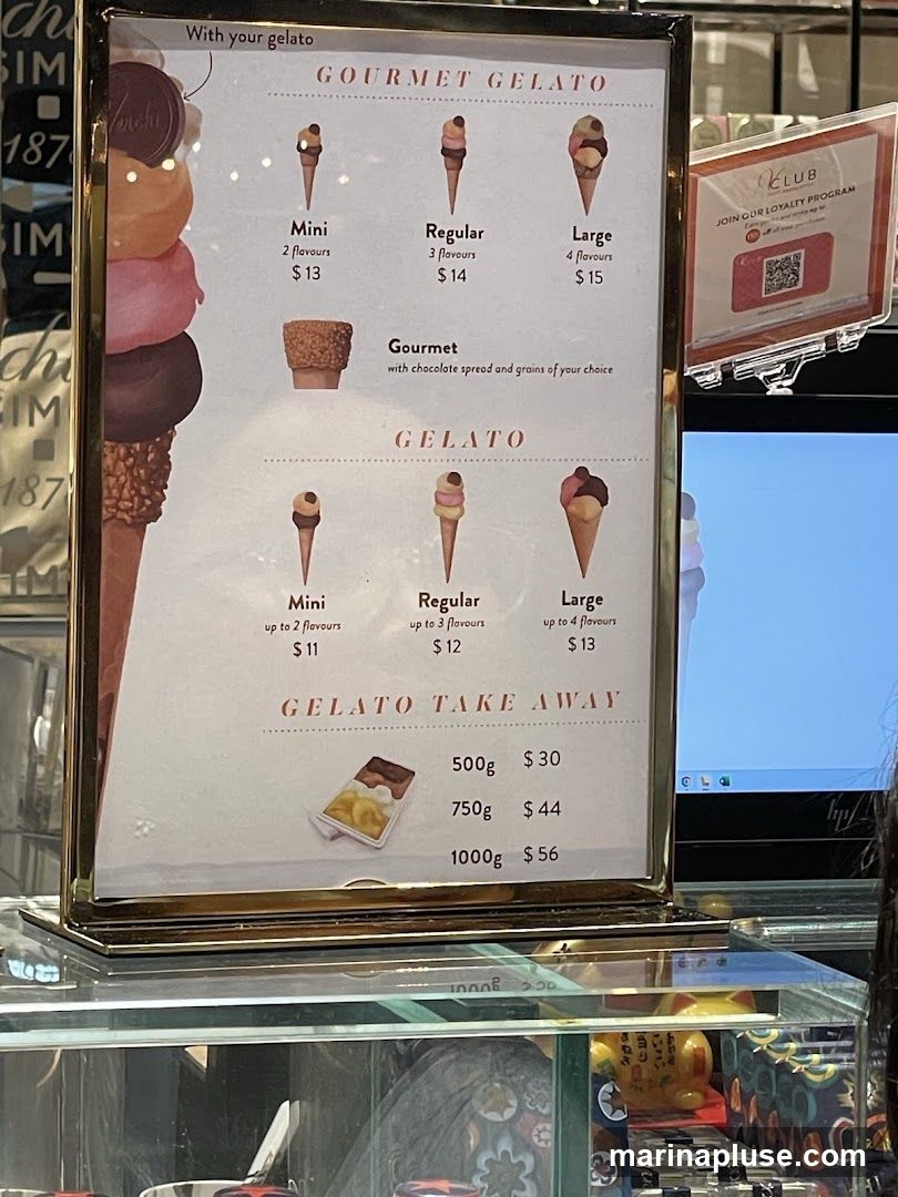 A menu board displaying various gelato options and prices.
