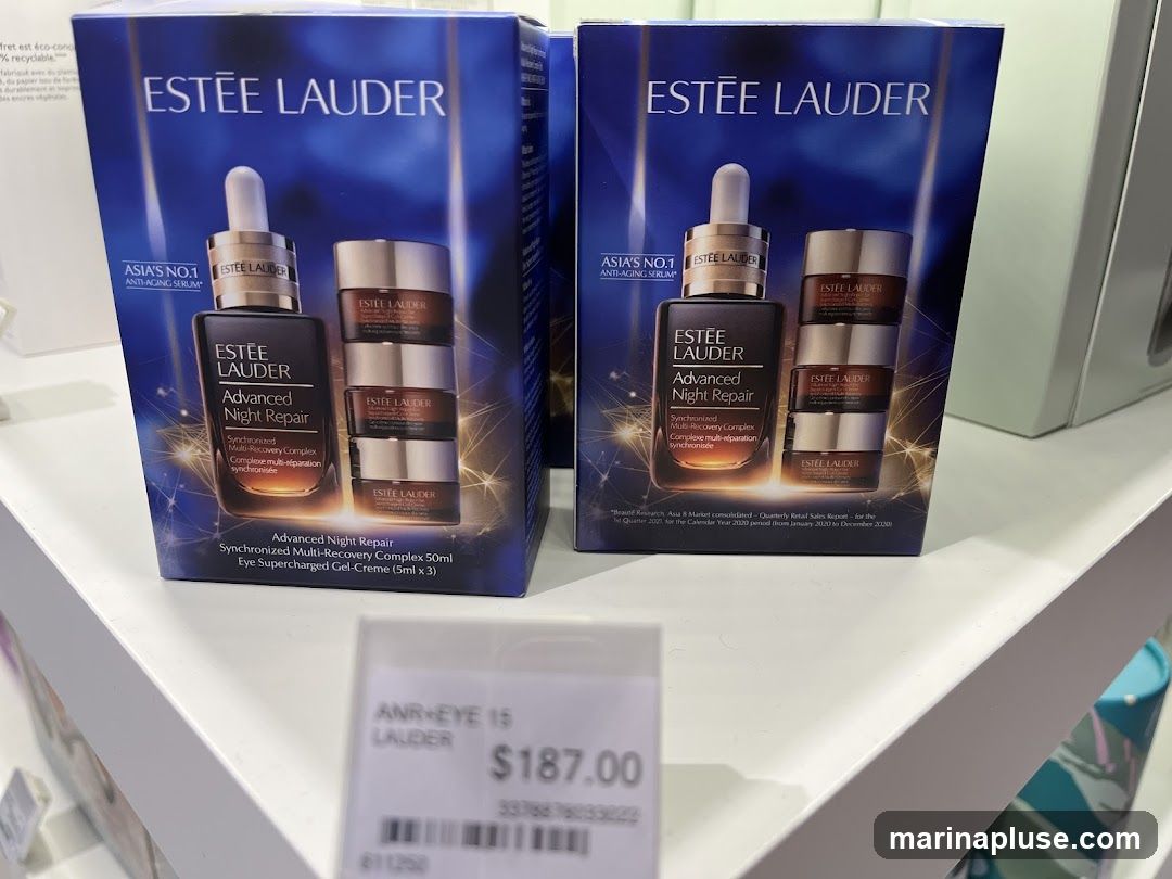 Two boxes of Estee Lauder Advanced Night Repair Synchronized Multi-Recovery Complex serum and eye cream set are displayed on a shelf. A price tag is visible in the foreground.