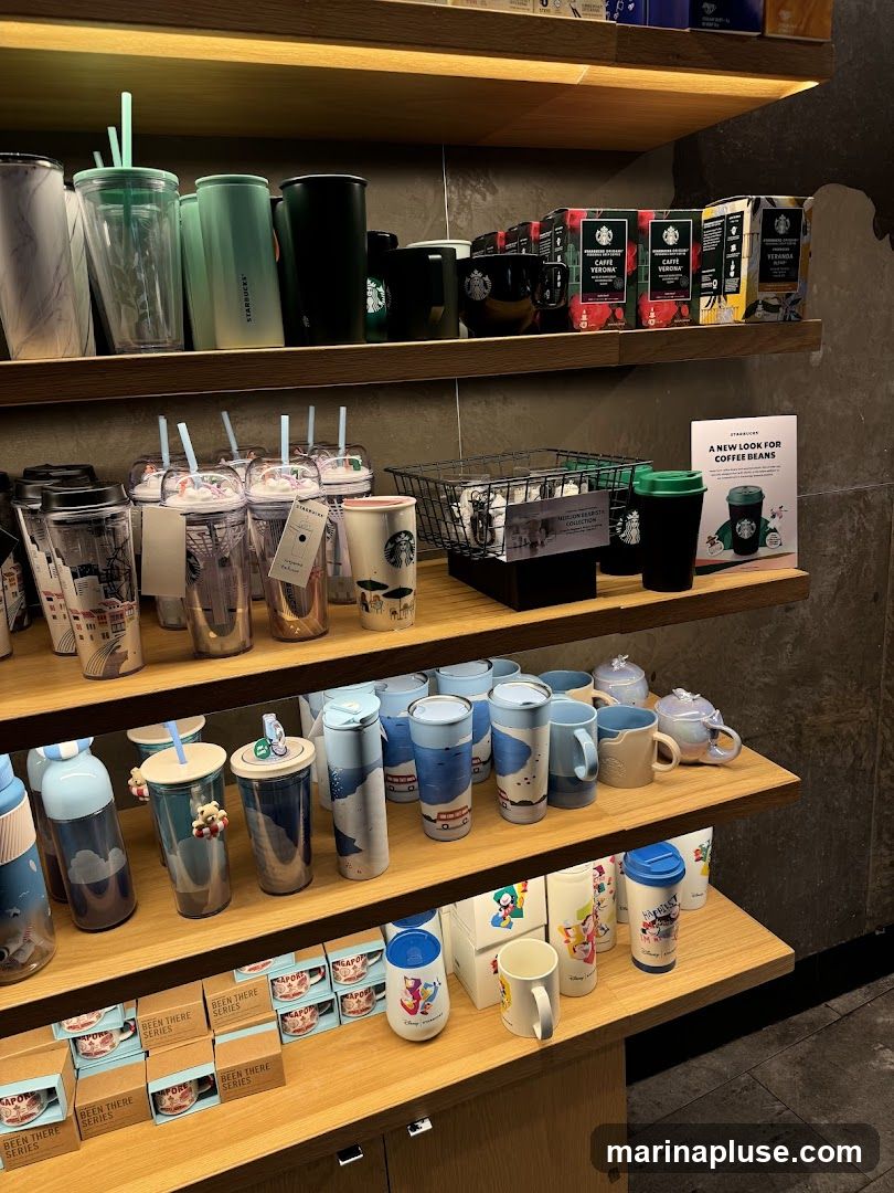 Shelves stocked with various Starbucks merchandise, including tumblers, mugs, and coffee bean packages. A promotional sign for coffee beans is visible on the right.