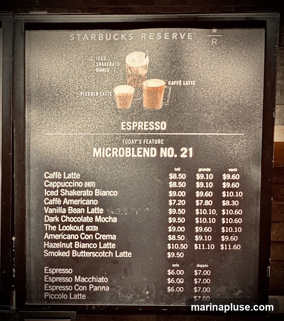 A menu board for Starbucks Reserve featuring espresso drinks and their prices in tall, grande, and venti sizes. Today's feature is Microblend No. 21.