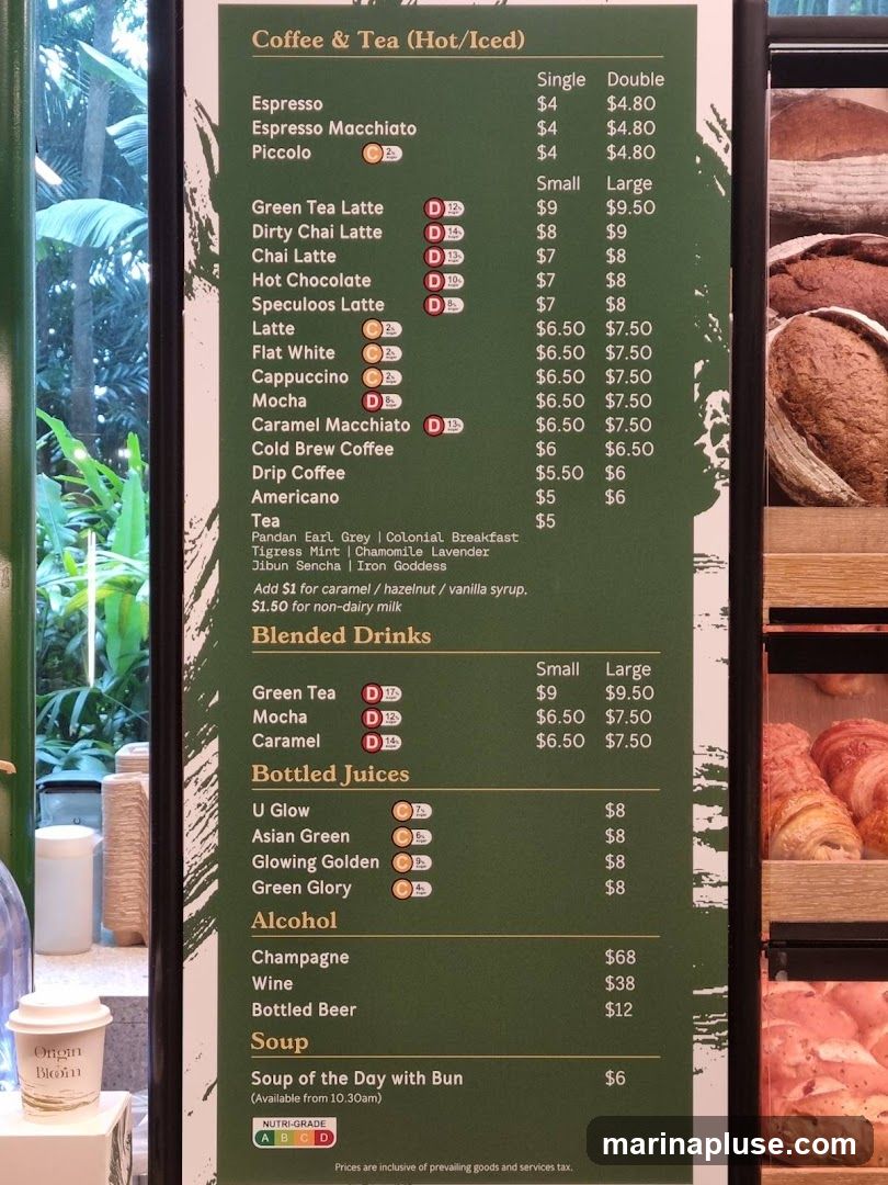 A menu board displaying coffee, tea, blended drinks, bottled juices, alcohol, and soup options.