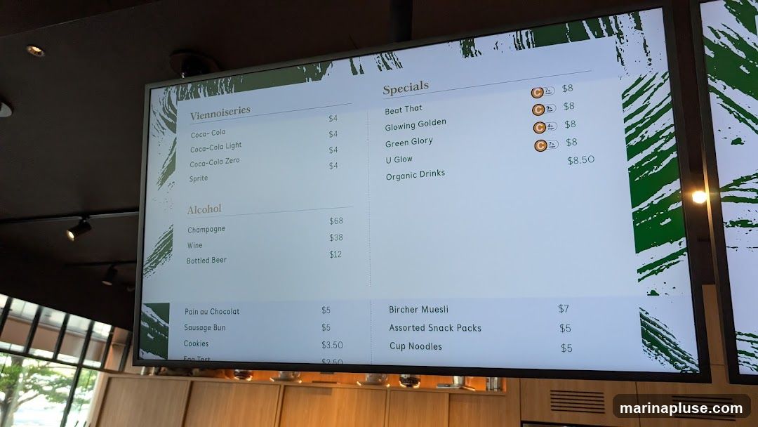 A digital menu board displaying various food and drink items.