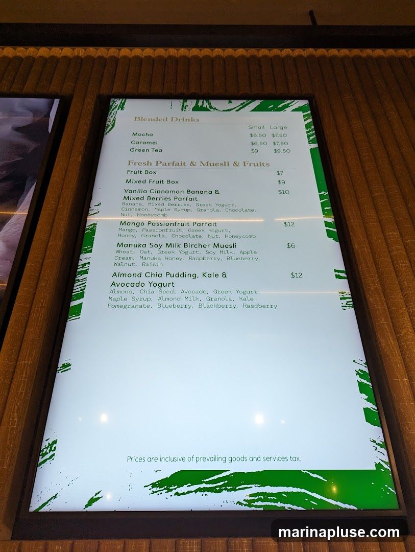 A digital menu displaying blended drinks, parfaits, muesli, and chia pudding options.