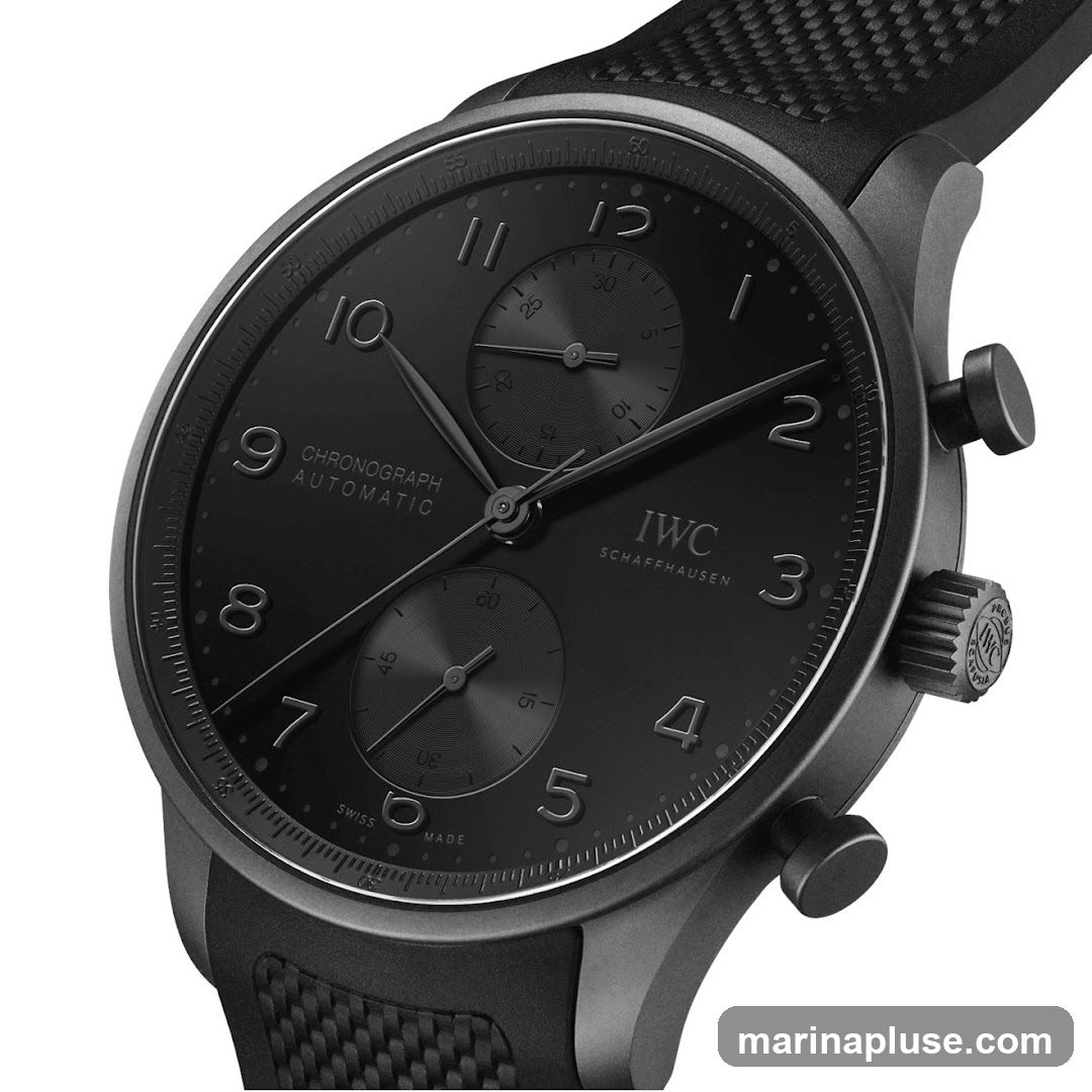 A close-up, studio shot of a black IWC Schaffhausen chronograph watch with a black dial and black strap. The watch features Arabic numerals for hours 1 through 12, with sub-dials for chronograph functions. The IWC Schaffhausen logo is visible on the dial.
