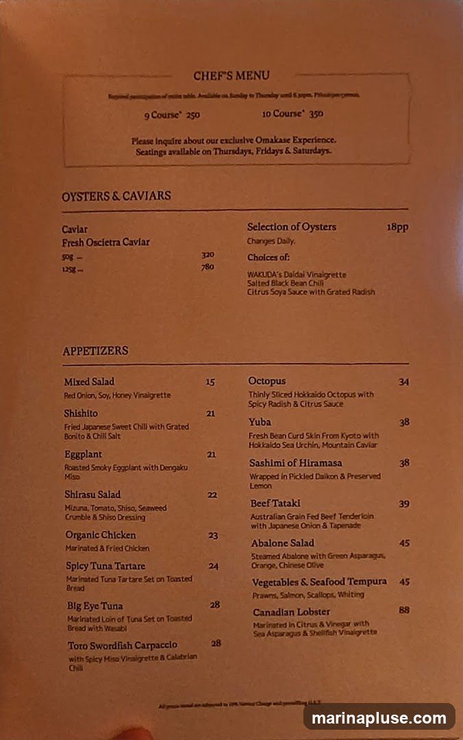 A menu with sections for Oysters & Caviar and Appetizers. It also lists Omakase Experience options.