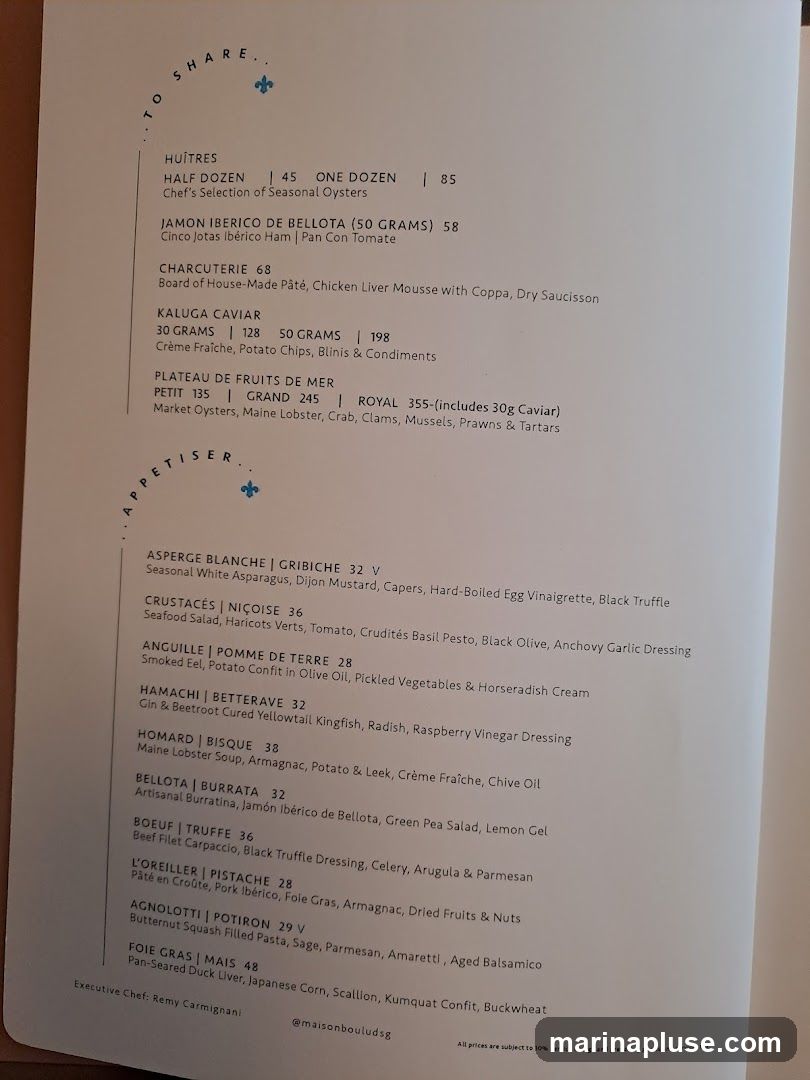 A menu with sections for Huîtres, Charcuterie, Caviar, Plateau de Fruits de Mer, and Appetisers.