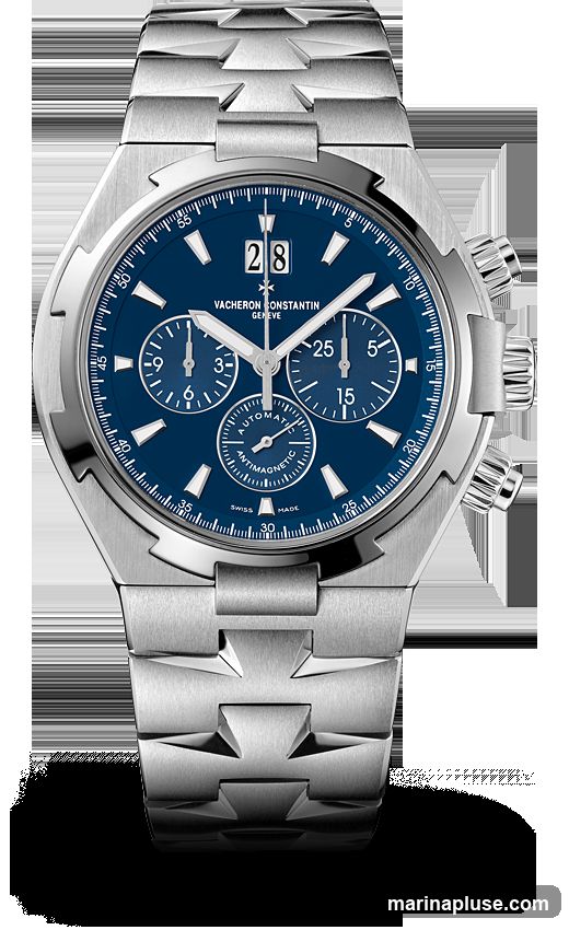 A close-up studio shot of a Vacheron Constantin chronograph watch with a blue dial and stainless steel bracelet. The watch features a date window at the 12 o'clock position, three subdials, and a tachymeter scale on the bezel. The brand name and "Geneve" are visible on the dial.