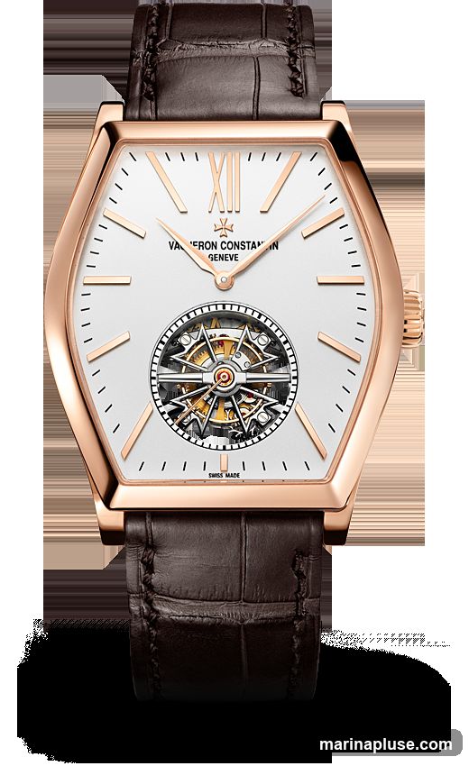 A close-up studio shot of a Vacheron Constantin watch with a white dial, rose gold case, and brown alligator leather strap. The watch features Roman numerals for hours, a tourbillon complication at the 6 o'clock position, and the brand's signature Maltese cross logo. The text "VacherON CONSTANTIN GENEVE" and "SWISS MADE" are visible on the dial.