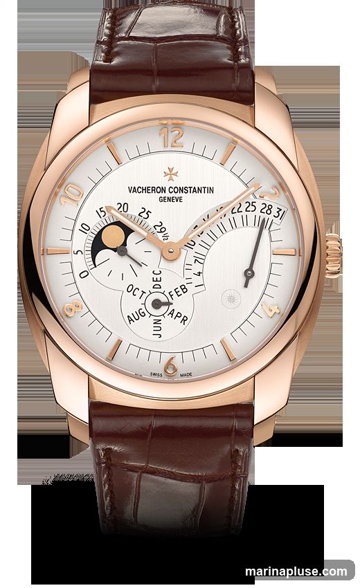 A close-up studio shot of a Vacheron Constantin watch with a white dial, rose gold case, and brown alligator leather strap. The watch features a moon phase complication, date display, and month indicator. The brand name and "Geneve" are visible on the dial.