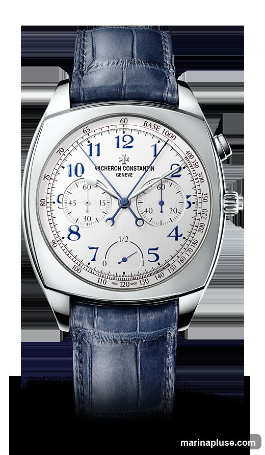 A close-up studio shot of a Vacheron Constantin chronograph watch with a white dial, blue Arabic numerals, and blue hands. The watch features two subdials and a tachymeter scale around the outer edge of the dial. It is fitted with a blue alligator leather strap. The background is black.