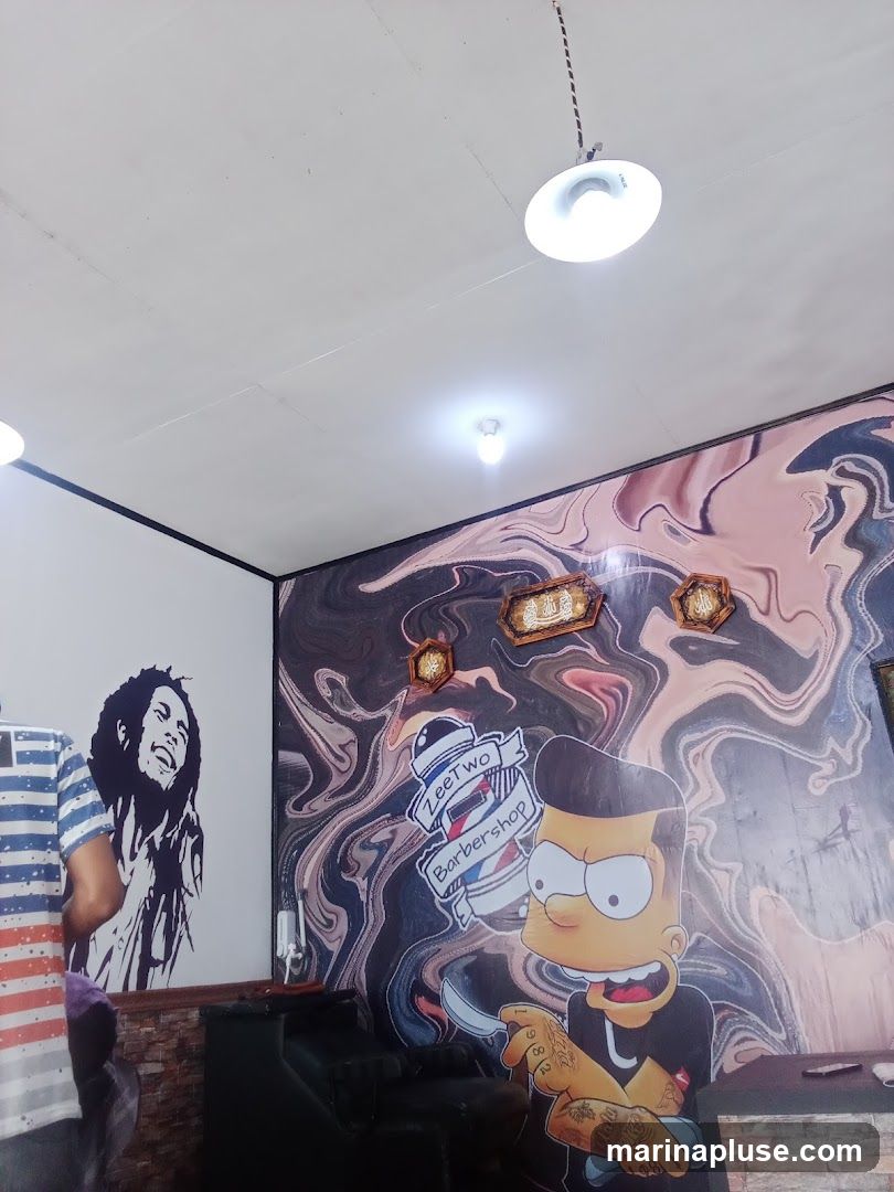 The interior of a barbershop decorated with murals of Bob Marley and Bart Simpson. A sign for "ZeeTwo Barbershop" is visible.