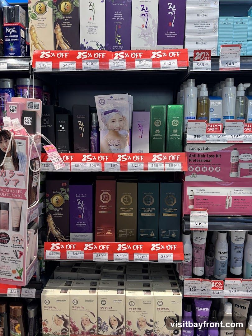 A retail shelf displaying various hair care products, including shampoos, conditioners, hair packs, and treatments. Many products are on sale with prominent "25% OFF" signage. Brands visible include Hoyu, Rose Baie, Hairtex, and Energy Life.