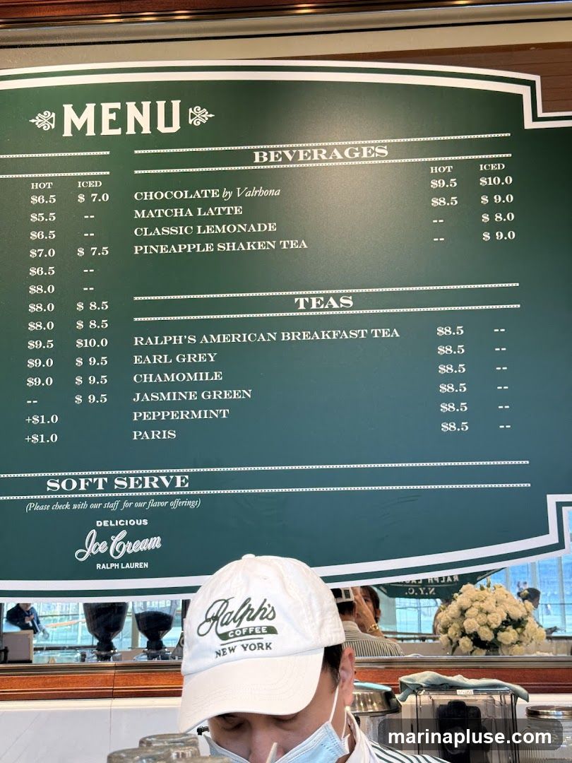 A menu board displaying beverages and teas.
