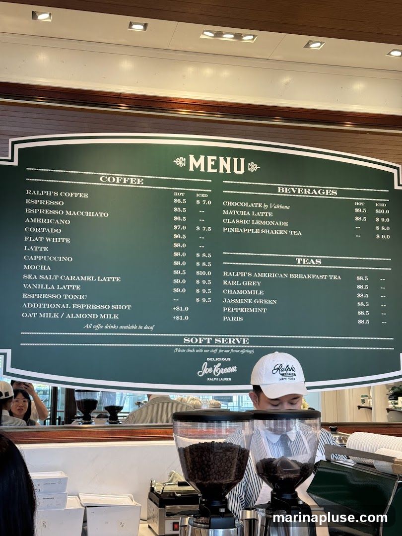 A menu board displaying coffee, beverages, teas, and soft serve ice cream options.