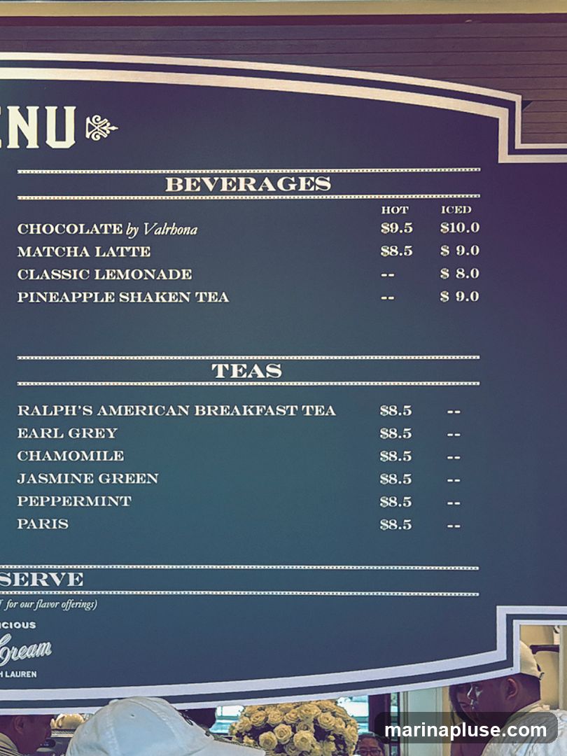 A menu board with beverages and teas.