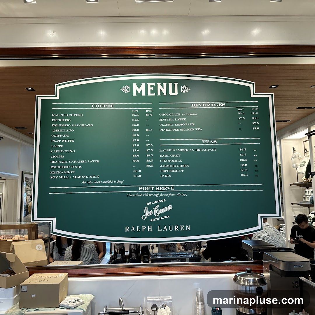 A green menu board with white text displays coffee, beverages, and teas. Below the beverage section, there is a soft serve ice cream section.