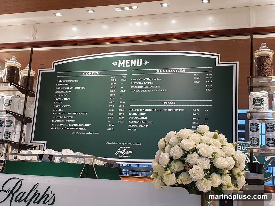 A menu board with sections for Coffee, Beverages, and Teas. It lists various coffee drinks, beverages like chocolate and lemonade, and teas such as Earl Grey and Jasmine Green, with hot and iced prices.