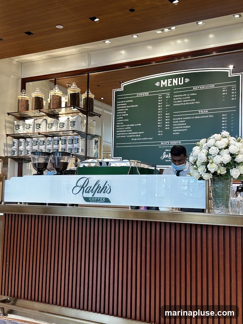 A menu board for Ralph's Coffee, featuring coffee, beverages, teas, and soft serve options.