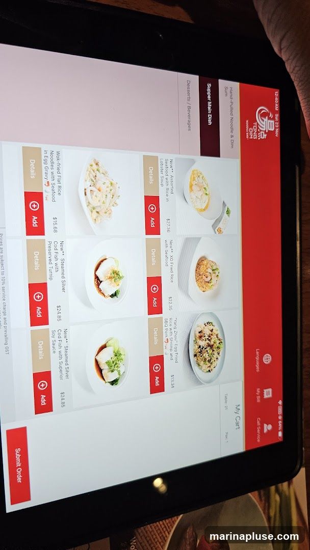 A digital menu displaying various dishes with images and prices.