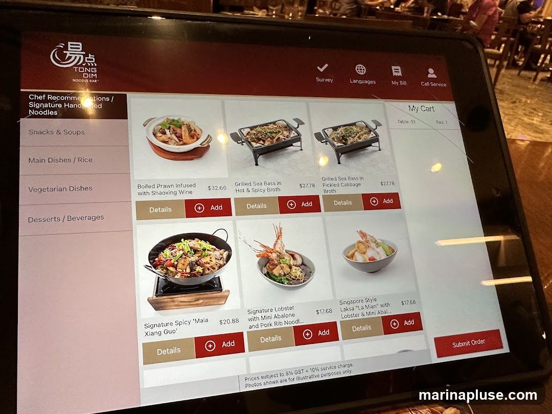Digital menu displaying chef recommendations and various dishes.