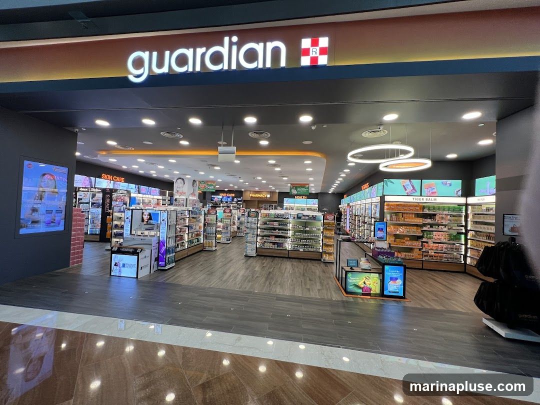 The exterior view of a Guardian pharmacy, showcasing its wide entrance and well-lit interior filled with shelves of health and beauty products. The prominent 'guardian' logo is visible above the entrance. Displays for 'Skin Care', 'Health', 'Hair Care', and 'Pharmacy' are visible inside.
