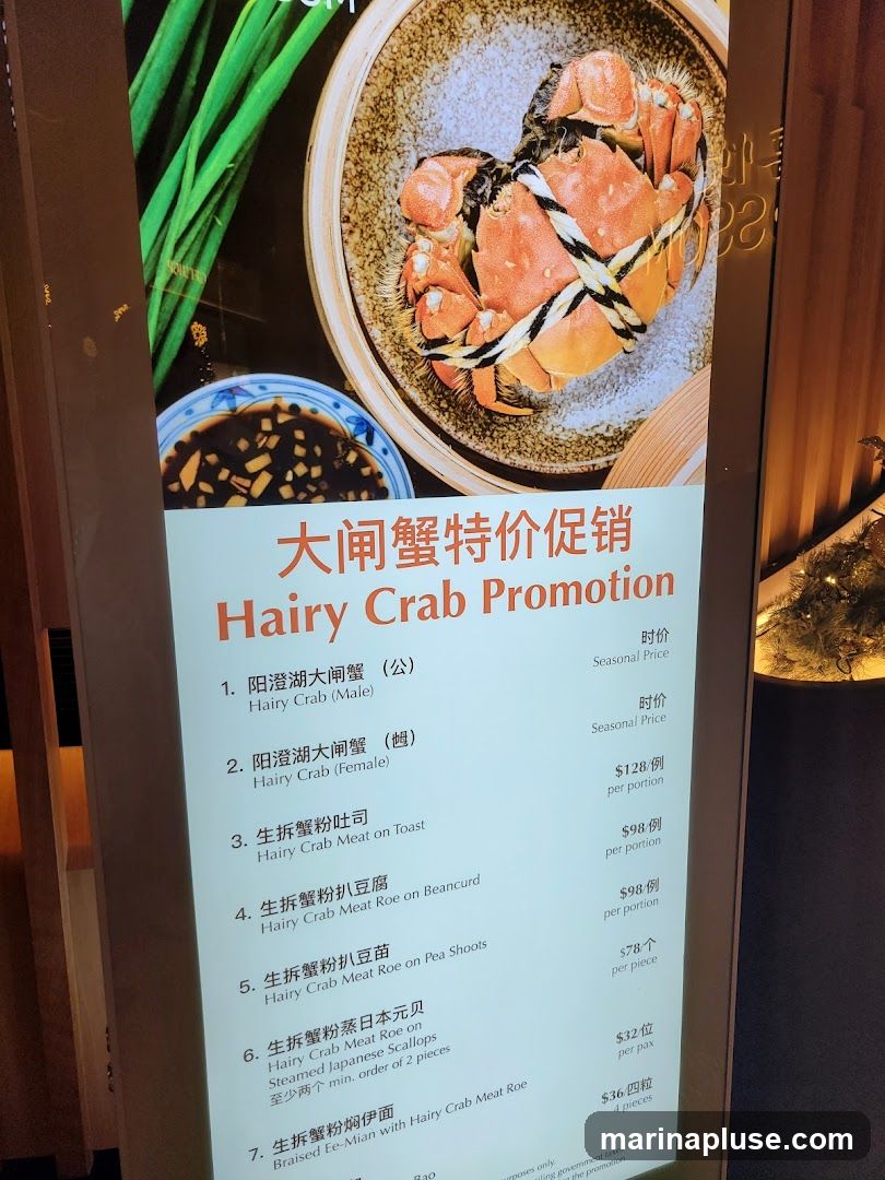A menu board advertising a Hairy Crab promotion with various crab dishes and prices.