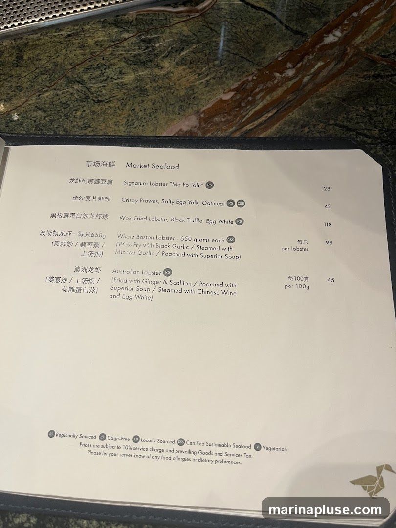 Menu section for Market Seafood with various lobster and prawn dishes.