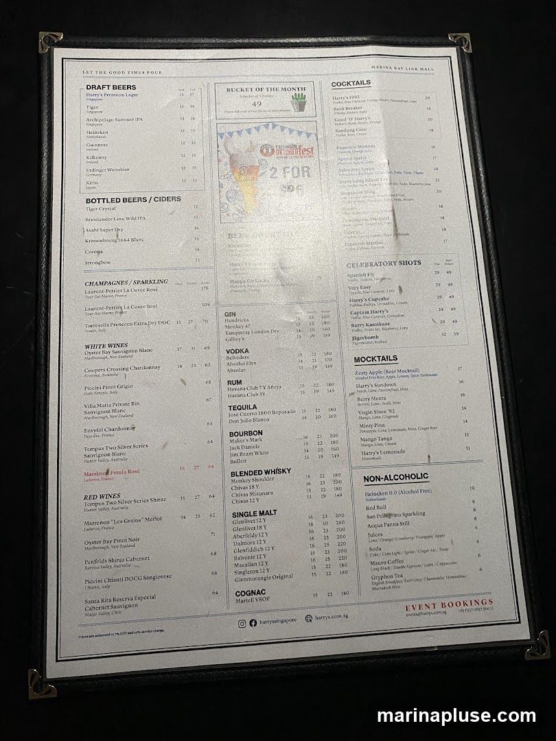 A menu from Harry's featuring a variety of drinks including draft beers, bottled beers, ciders, champagnes, sparkling wines, white wines, red wines, cocktails, celebratory shots, mocktails, gin, vodka, rum, tequila, bourbon, blended whisky, single malt whisky, cognac, and non-alcoholic beverages.