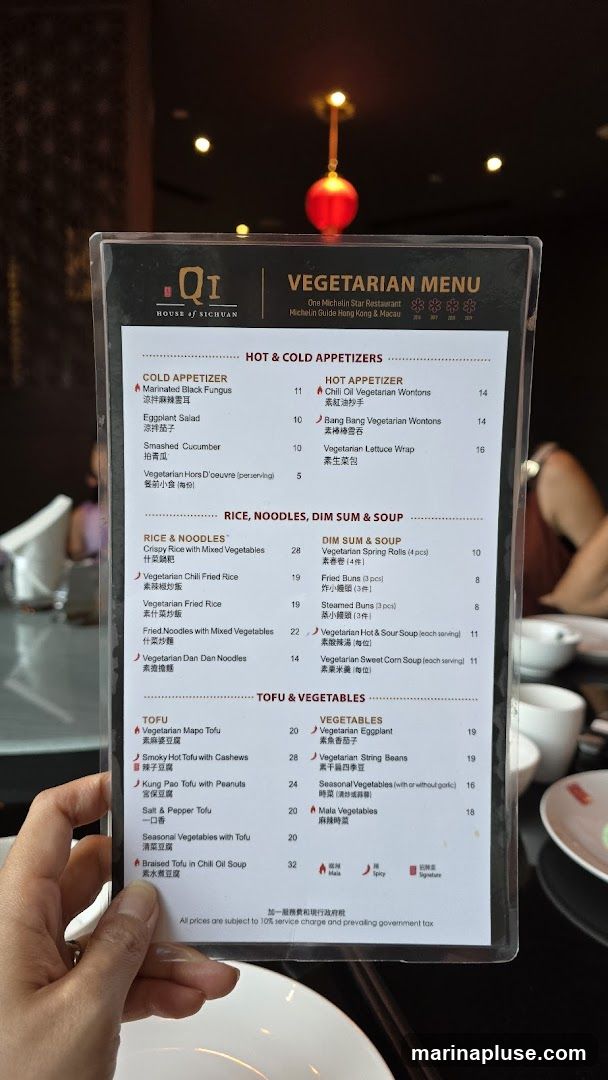 A vegetarian menu from Qi House of Sichuan, a One Michelin Star Restaurant. The menu features Hot & Cold Appetizers, Rice, Noodles, Dim Sum & Soup, and Tofu & Vegetables. Prices are subject to a 10% service charge and prevailing government tax.