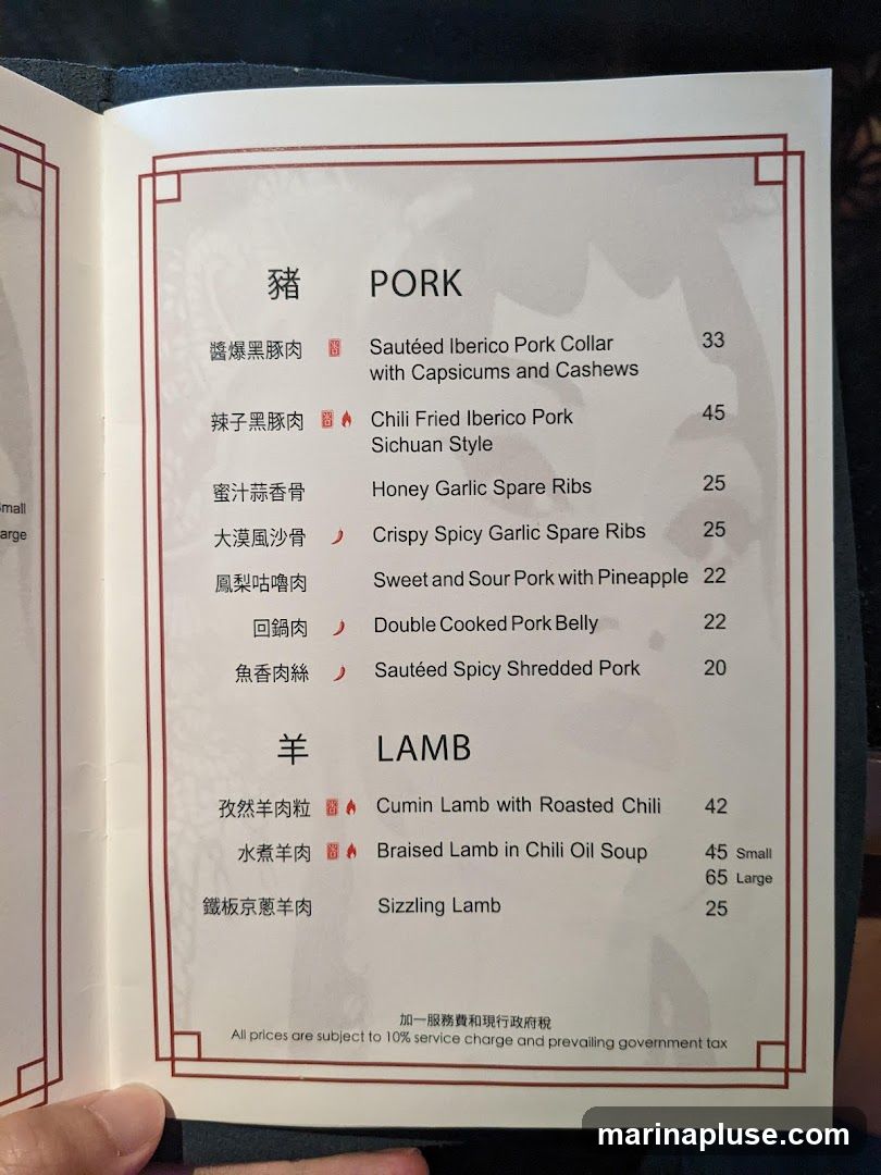 Menu section with Pork and Lamb dishes.