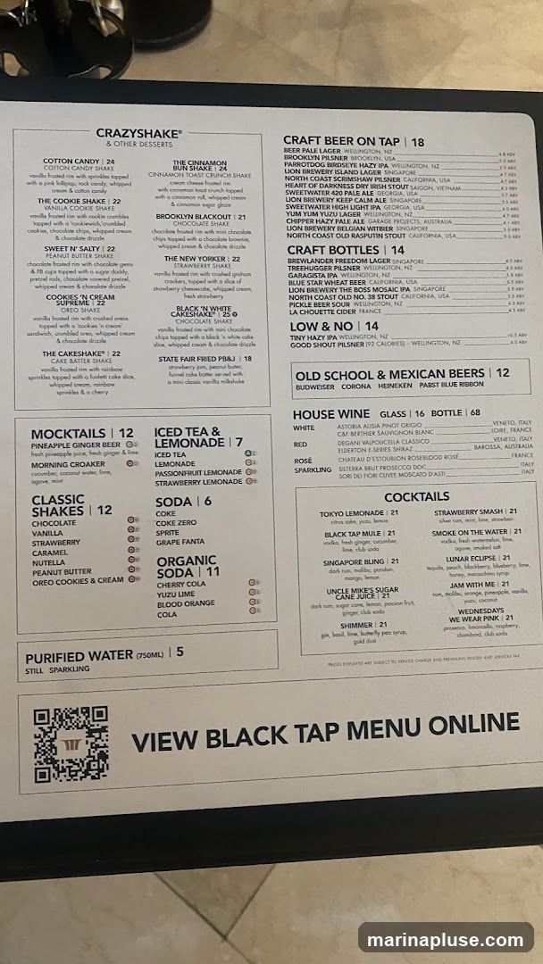 A menu featuring CrazyShakes, Mocktails, Classic Shakes, Iced Tea & Lemonade, Soda, Organic Soda, Purified Water, Craft Beer on Tap, Craft Bottles, Low & No alcohol options, Old School & Mexican Beers, House Wine, and Cocktails.