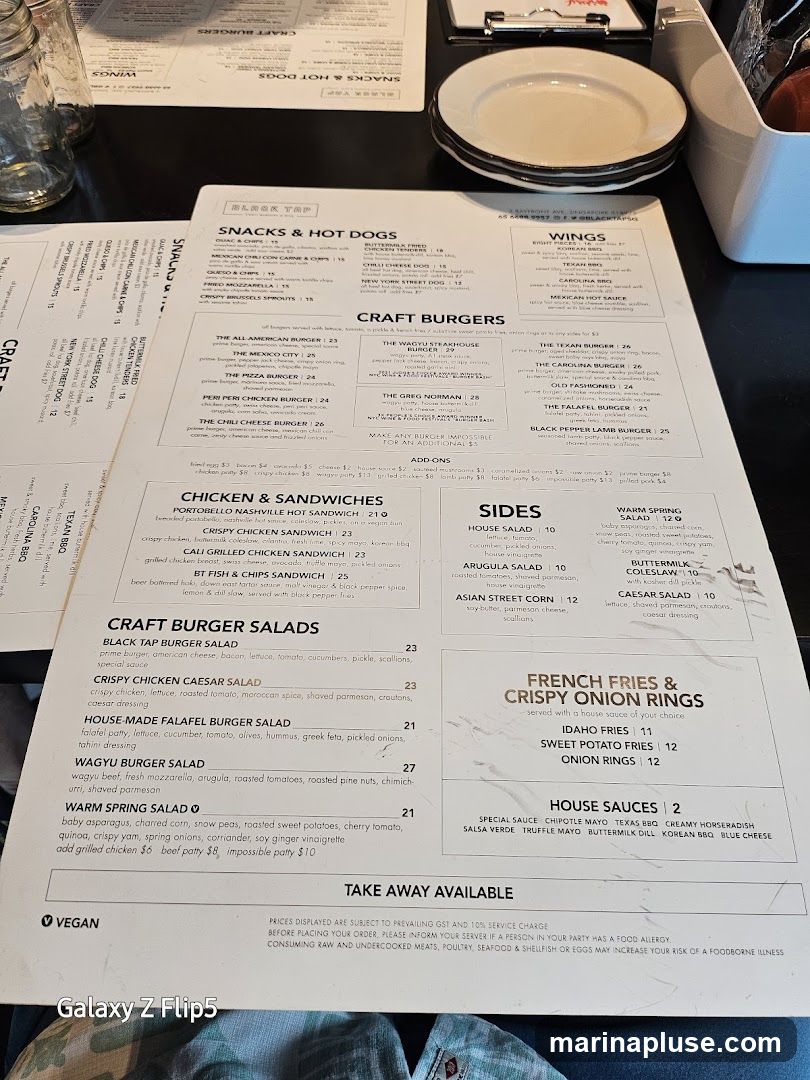 Menu featuring craft burgers, snacks, hot dogs, wings, chicken sandwiches, salads, sides, and french fries/onion rings.