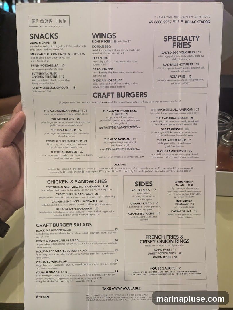 Menu with snacks, wings, specialty fries, craft burgers, chicken & sandwiches, craft burger salads, sides, and french fries & crispy onion rings.