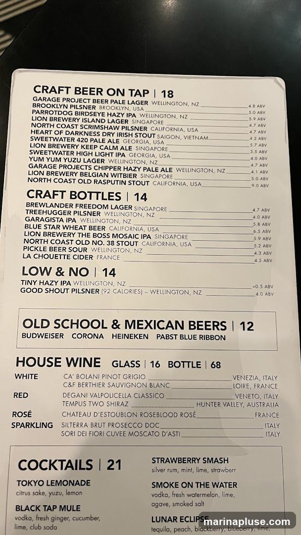 A menu with sections for Craft Beer on Tap, Craft Bottles, Low & No, Old School & Mexican Beers, House Wine, and Cocktails.