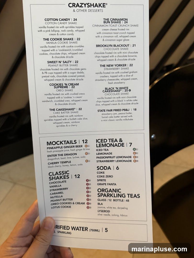 Menu featuring shakes, mocktails, iced teas, lemonades, sodas, and organic sparkling teas.