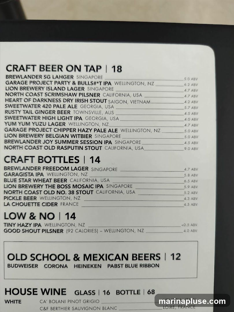 A menu listing various craft beers on tap and in bottles, low and no alcohol options, old school and Mexican beers, and house wine.
